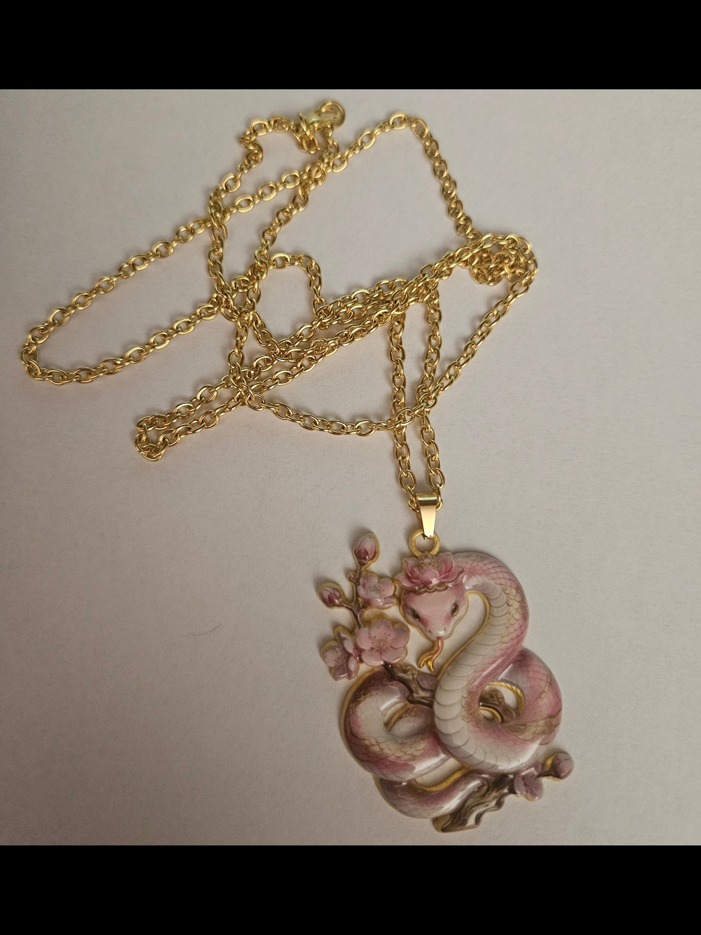 Gold-Tone Pink Enamel Snake Pendant Necklace - Floral Accent